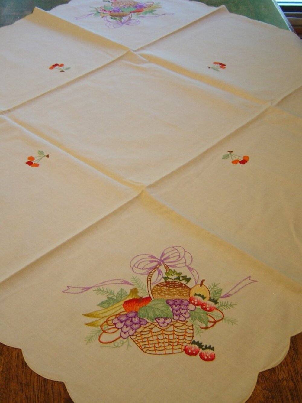 Machine embroidered tablecloth with fruit basket design--33" square